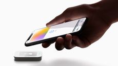 A person paying using an Apple Card and Apple Pay.
